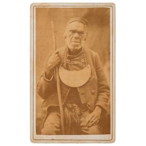 King Johnny Aboriginal in European clothing, wearing a…
