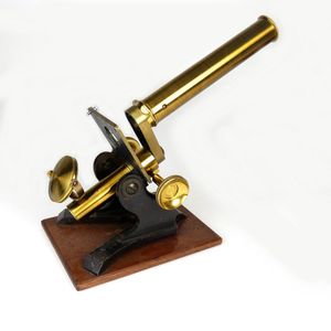 A Victorian brass microscope, in mahogany box with extra lenses,…