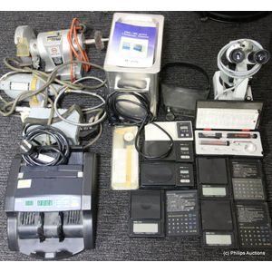 A collection of equipment including microscope, soldering iron,…