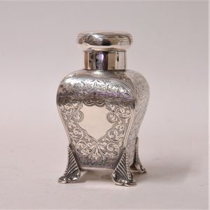 A late Victorian silver tea caddy, the shaped square section…