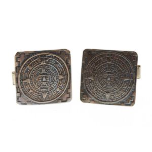 A pair of sterling silver Mexican cuff links, square plaques…