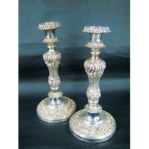A pair of Old Sheffield plate candlesticks, foliate columns.…