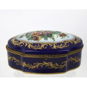 A French porcelain Sevres style jewel casket. Deep blue with…