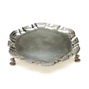 A hexagonal salver on three scrolled feet, hallmarked for…