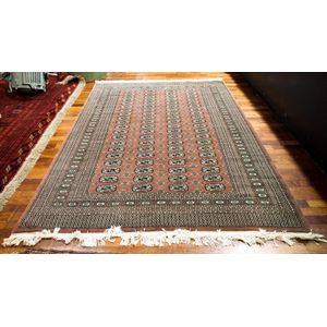 A Pakistan hand knotted Bokhara rug with muted mauve, brown…