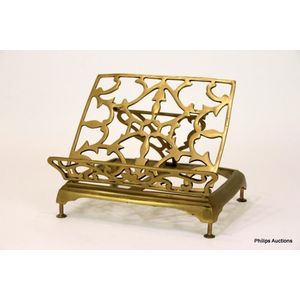 A vintage brass book stand, mid 20th century the adjustable…