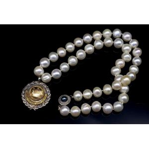 George VI silver fob medal and modern pearl necklace. The fob…