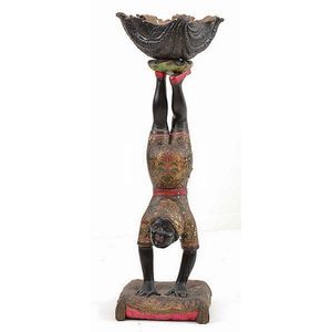A Venetian polychrome blackamoor figure carved as a male…