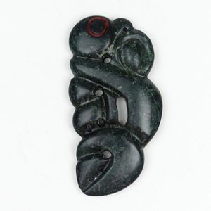 Mike Higgs greenstone carved manaia form pekapeka pendant, red…