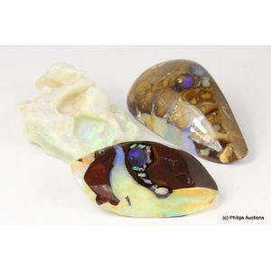 A collection of opal specimen, comprising three freeform opals…