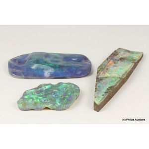 A collection of opal specimen, comprising three freeform opals…