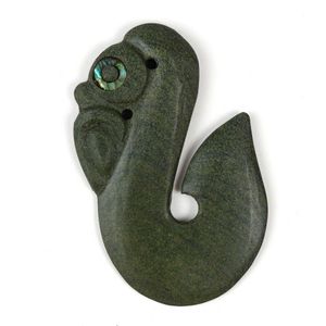 A green stone manaia/matau pendant by Mike Higgs, with paua…