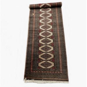 A Persian Bukhara runner, the field decorated with multiple…