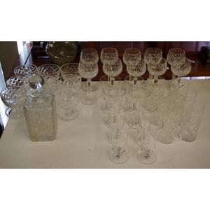 Two sets of crystal glasses, a decanter and others setting for…