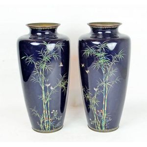 A pair of Japanese cloisonne vases depicting birds in bamboo…