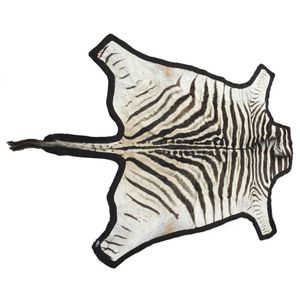 A Burchell's zebra skin rug, the skin backed on to black felt,…