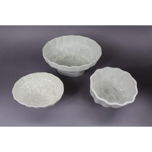 Set of three glazed ceramic fruit design jelly moulds, 12 cm…