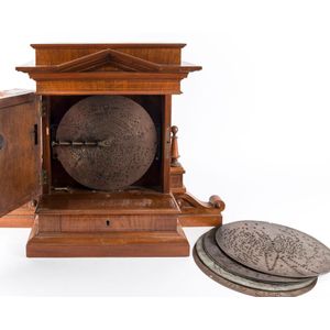 Polyphon musical clock in architectural timber case, with 6…