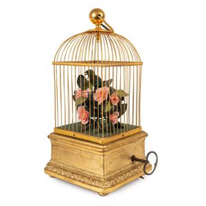 French singing birdcage automaton with one bird in fine gilded…
