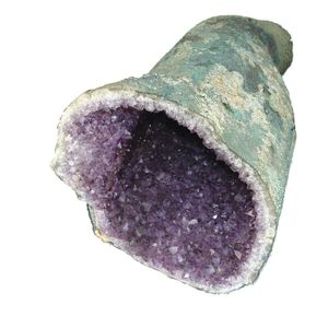 An impressive amethyst geode, irregular cylindrical form, open…
