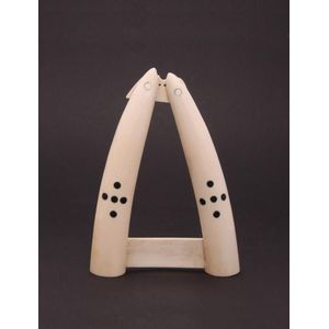 Two ivory half tusks with inlaid black Circles. Height 22 cm