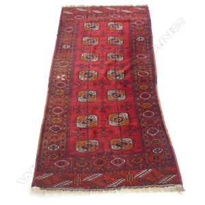 A hand-knotted small Bukhara runner, decorated with Tekke…