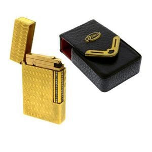 A Doupont lighter, gold plated engine turned lighter with white…