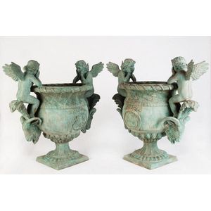 A pair of large Neo-Classical cast-iron urns. Provenance:…