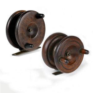 Two walnut free-spooling fishing reels, 3 inch and 3 1/2 inch,…