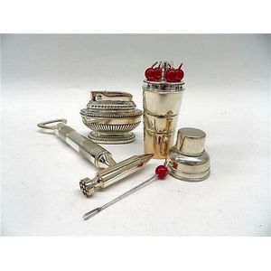 A novelty silver plate corkscrew, pickle fork holder and a…