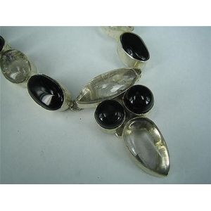 An onyx and quartz necklace, the pendant with rim-set Venus…