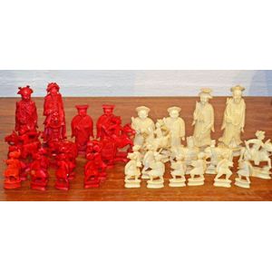 A Chinese carved ivory figural chess set a red stained and…