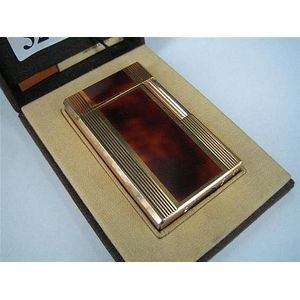 A Dupont lighter with Tortiseshell 'Lacque de Chine' case.…