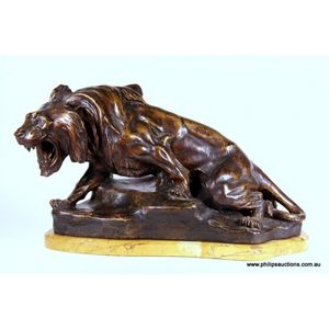 A terracotta 'Lion En Furie' by Thomas F Cartier (1879-1943) on…