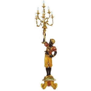 A decorative blackamoor lamp, floor standing on a colourful…