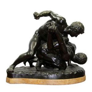 Bronze wrestling figure group set on a Sienna marble base.…