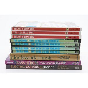 A collection of reference books on Bass guitar, including the…