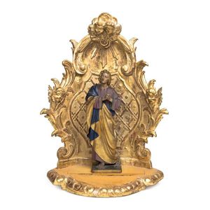 A carved and gilt Franciscan style figure of a saint within a…