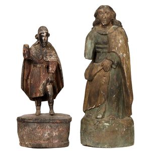 Two Spanish Colonial Santos figures, depicting saints in robes,…