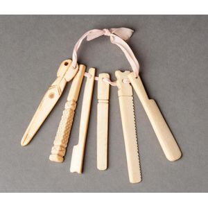 Antique ivory and bone baby teethers. Group of 19, some carved