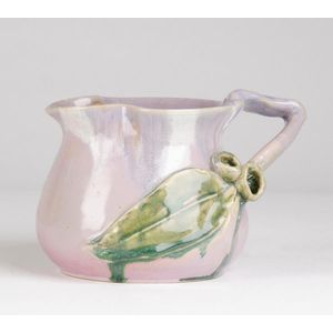 Remued: early pottery jug with applied gum leaf and nuts in…