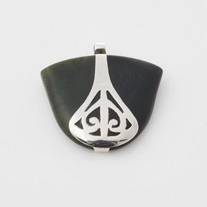 Silver handmade fan shaped pendant, featuring pounamu and…