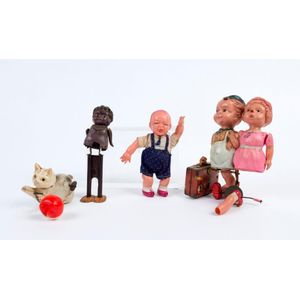 (faulty) with wind-up mechanism (in suitcase) celluloid wind-up…