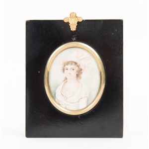A Georgian miniature on ivory of a woman with a white bonnet…