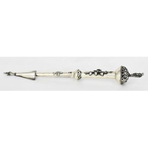 A silver torah yad, with high relief rose design and Rabbi…
