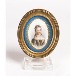 A French miniature portrait on porcelain in gilt frame, 19th…