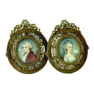 A pair of early/mid 20th century portrait miniatures in gilt…