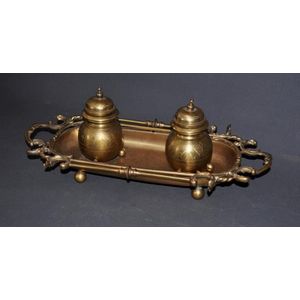 Early brass standish. 2 lidded inkwells on stand. Length 43 cm