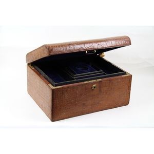 A reptilian leather jewellery box, initialled C.A.O. On top, 18…