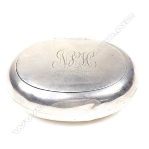 An Edwardian silver snuff box, oval form, original gilt to the…